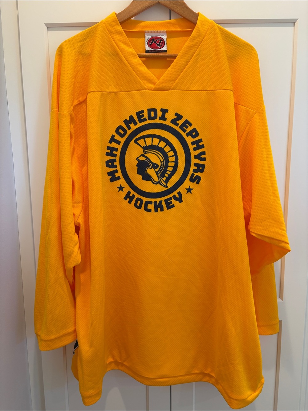 Mahtomedi Zephyr Yellow Gold Hockey Jersey with Navy Zephyrs Crest